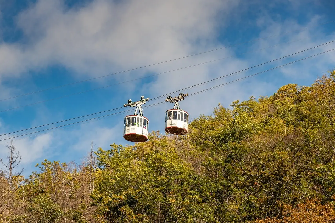 Cable car ride in Kuri Village offering stunning panoramic views of snow-covered mountains and valleys during winter.
